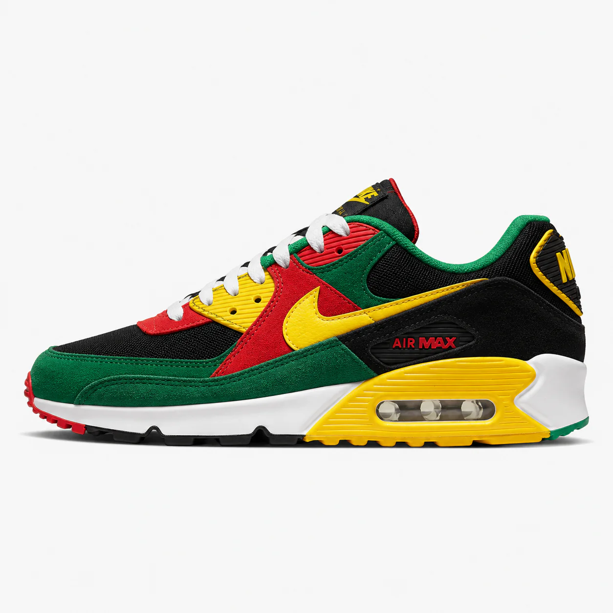 Nike Air Max 90 in black, green, yellow, red, side view of the sneaker on a white background.