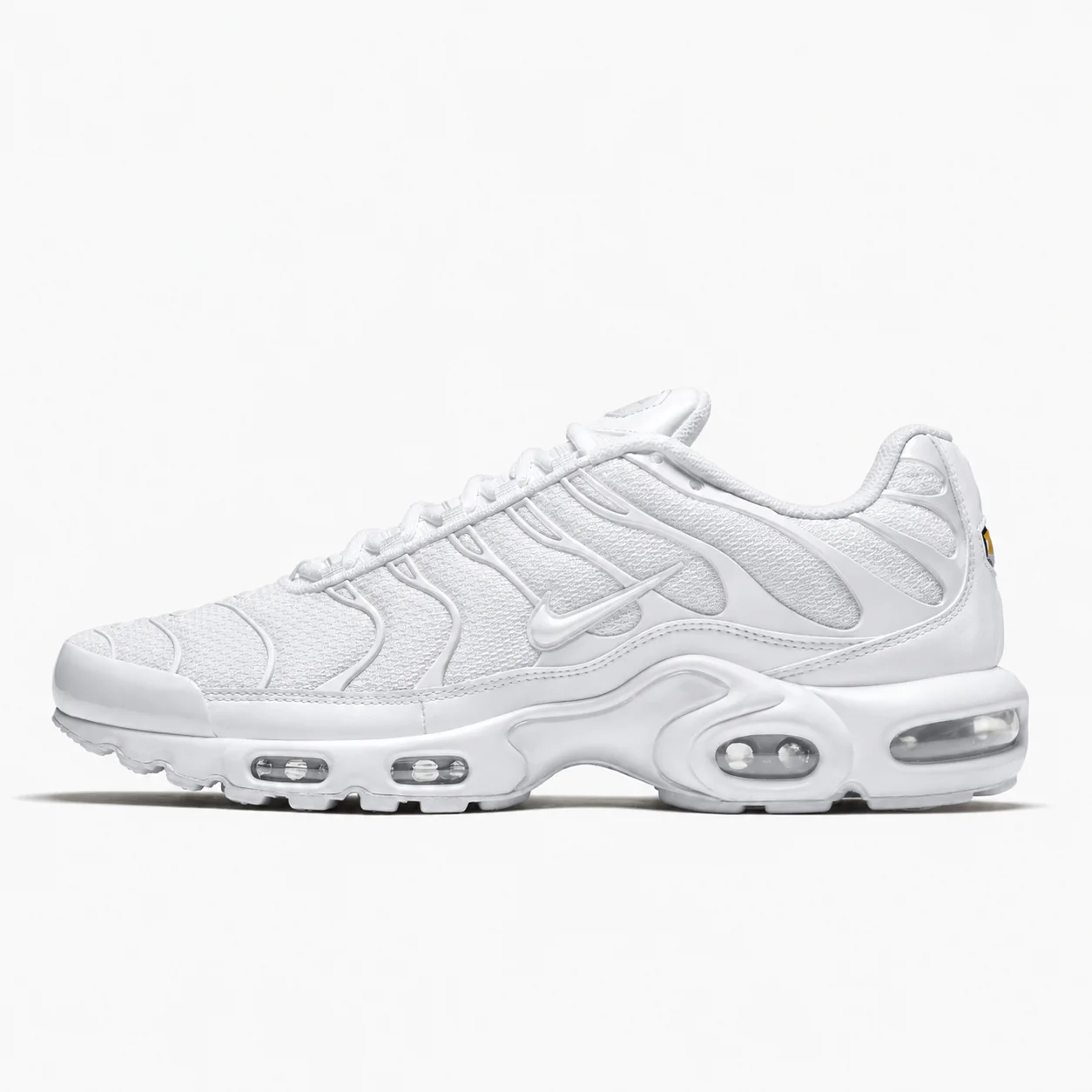 Nike Air Max Plus in white, side view of the sneaker on a white background.