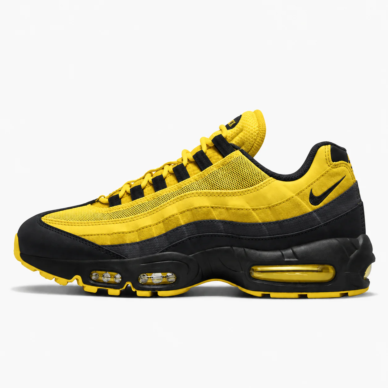 Nike Air Max 95 in yellow, black, side view of the sneaker on a white background.