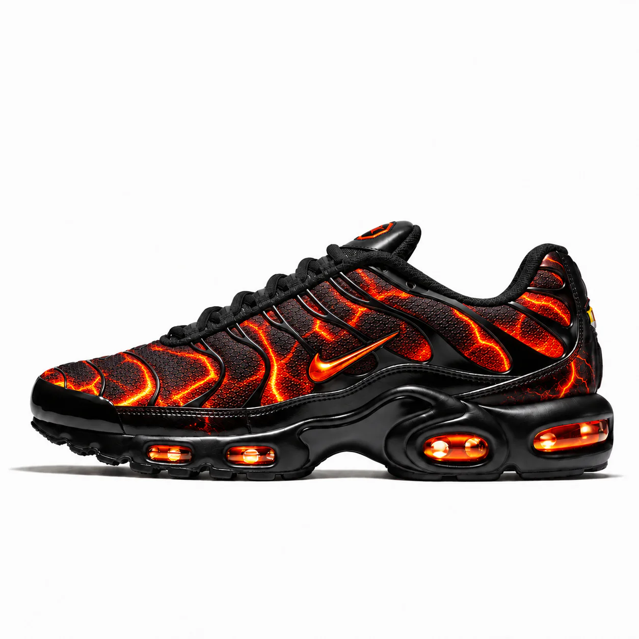 Nike Air Max Plus in black, orange, side view of the sneaker on a white background.