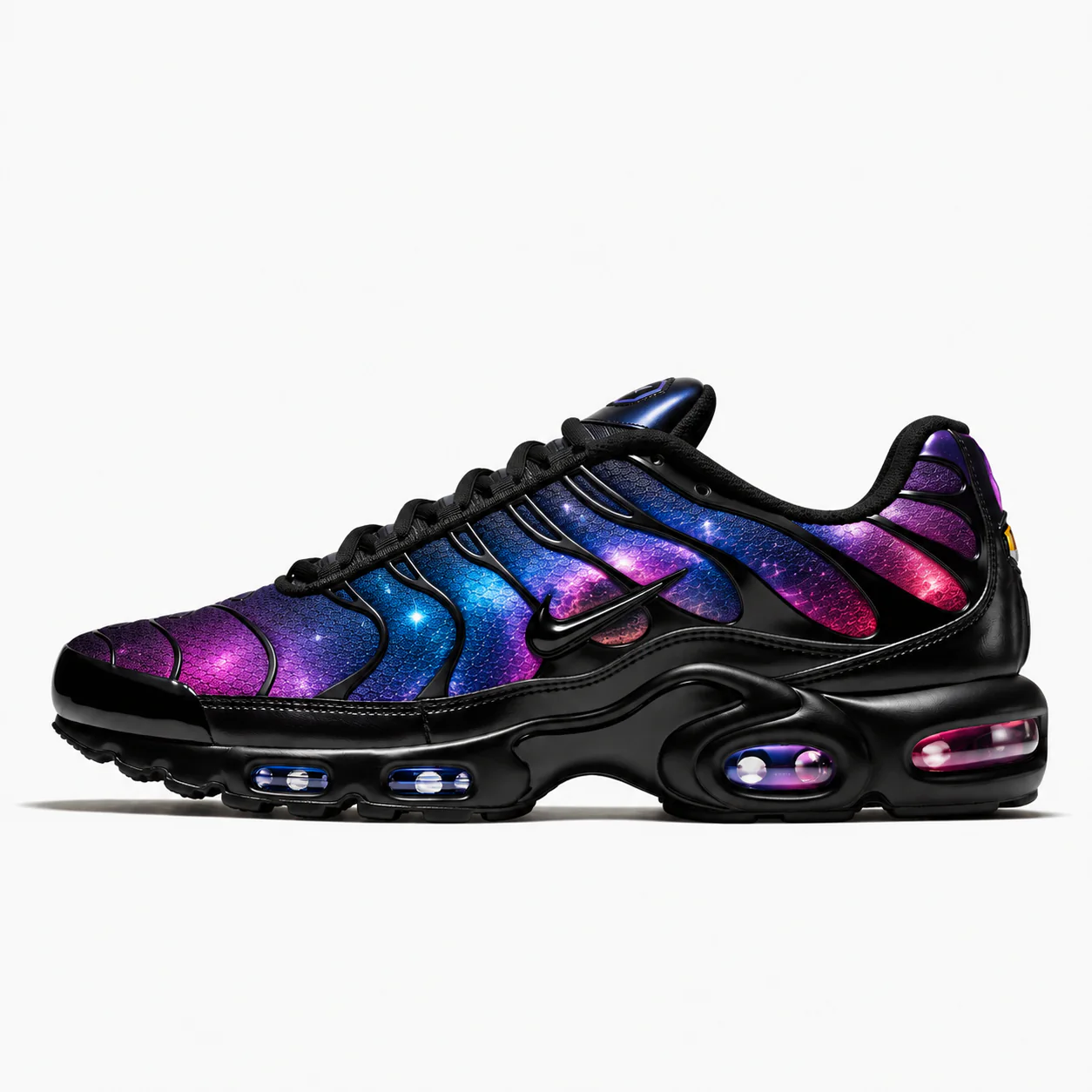 Nike Air Max Plus in black, blue, purple, side view of the sneaker on a white background.