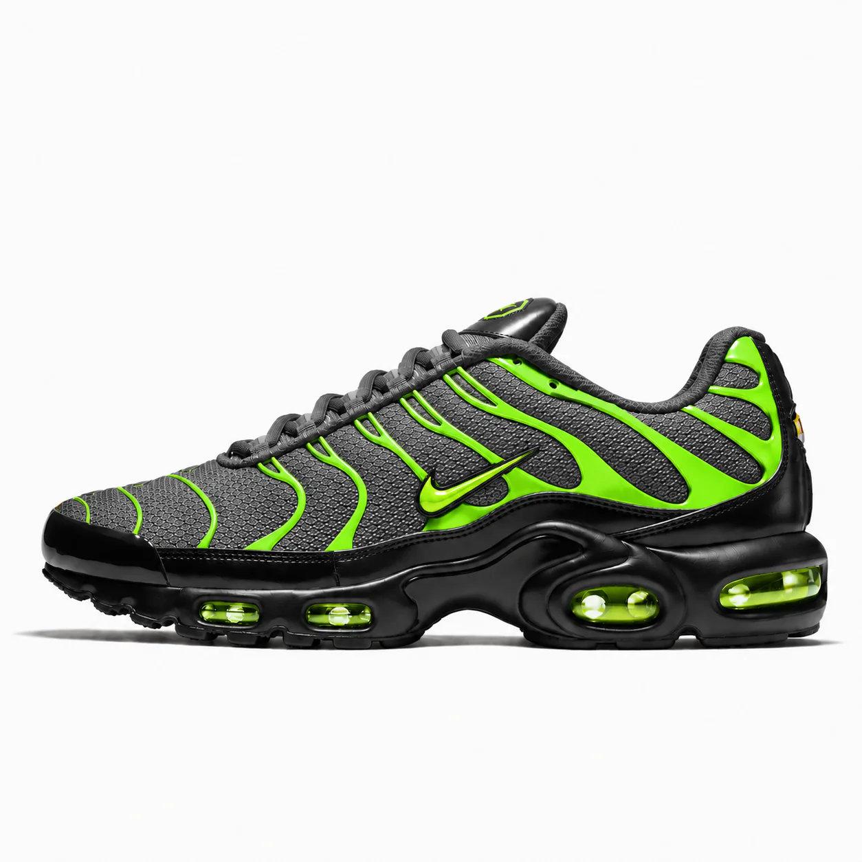 Nike Air Max Plus in black, volt green, side view of the sneaker on a white background.