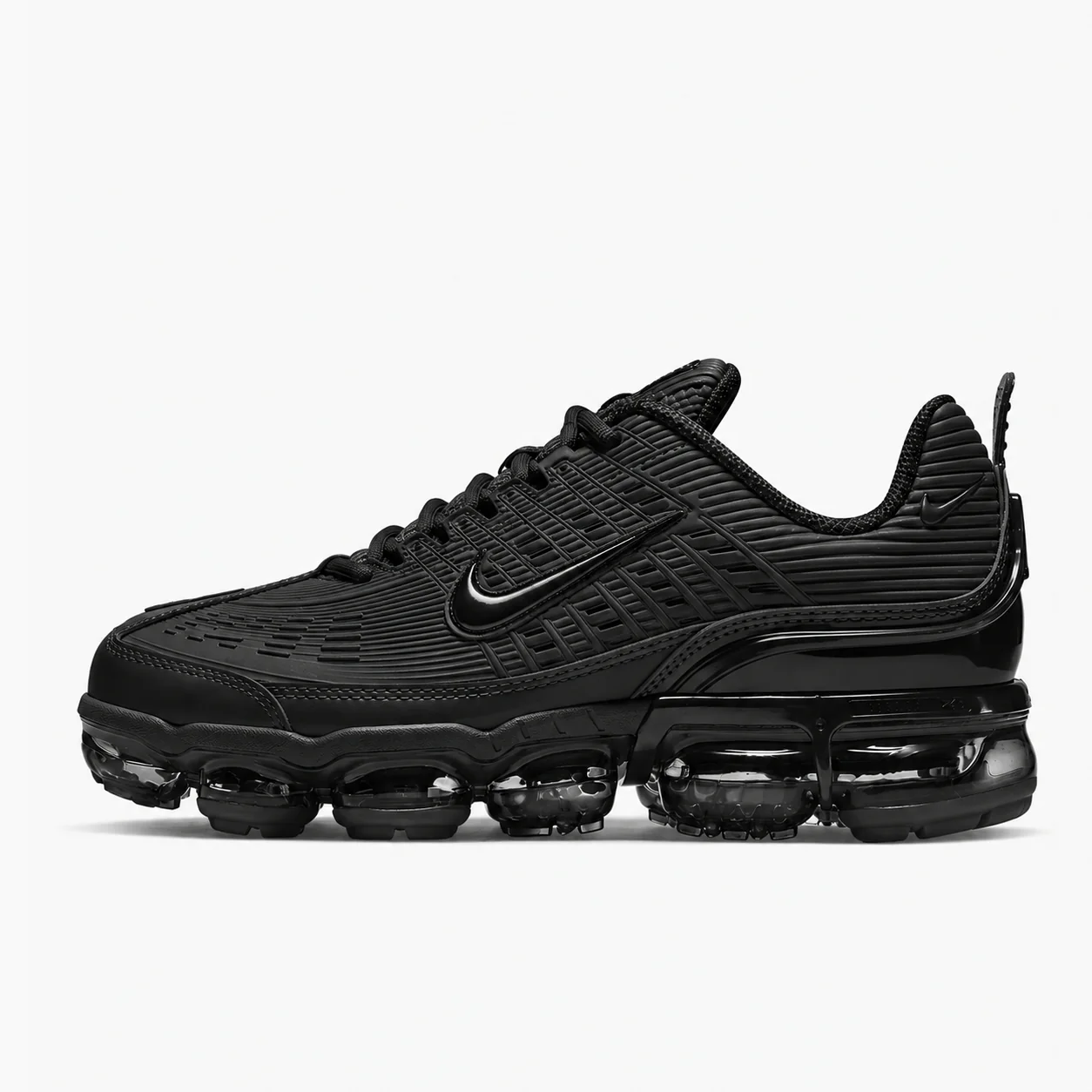 Nike Air VaporMax Plus in black, side view of the sneaker on a white background.