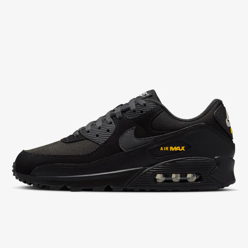 Nike Air Max 90 in black, gold, side view of the sneaker on a white background.