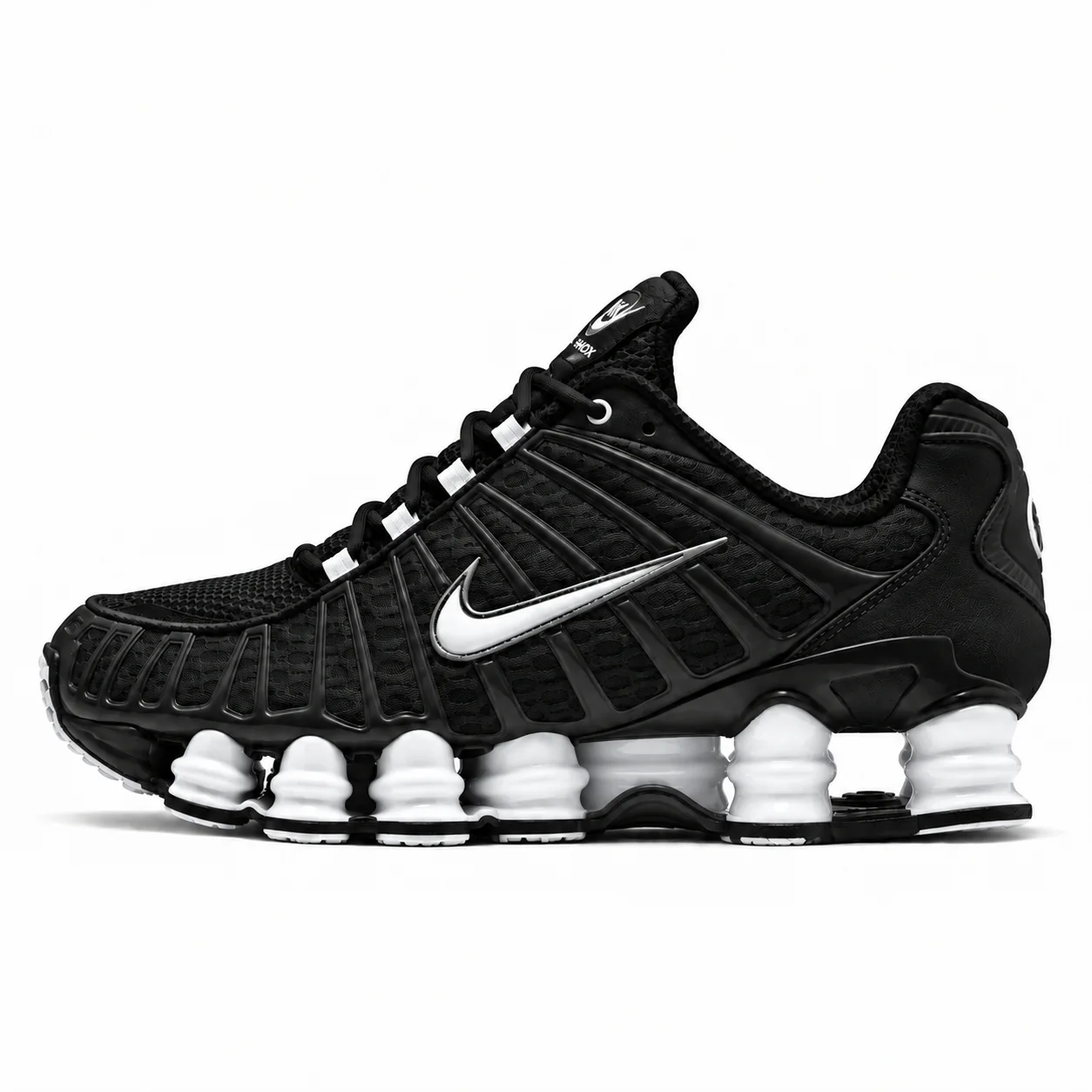 Nike Shox TL in black, white, side view of the sneaker on a white background.